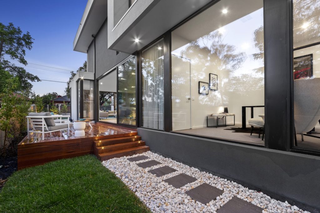 Ground floor extension with deck and rock path in Caulfield.
