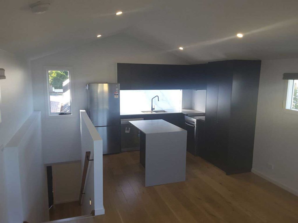 Second Storey extension in Glen Iris. Kitchen with Island by Mass Constructions.