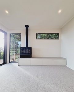 Living area with wood fire heater.
