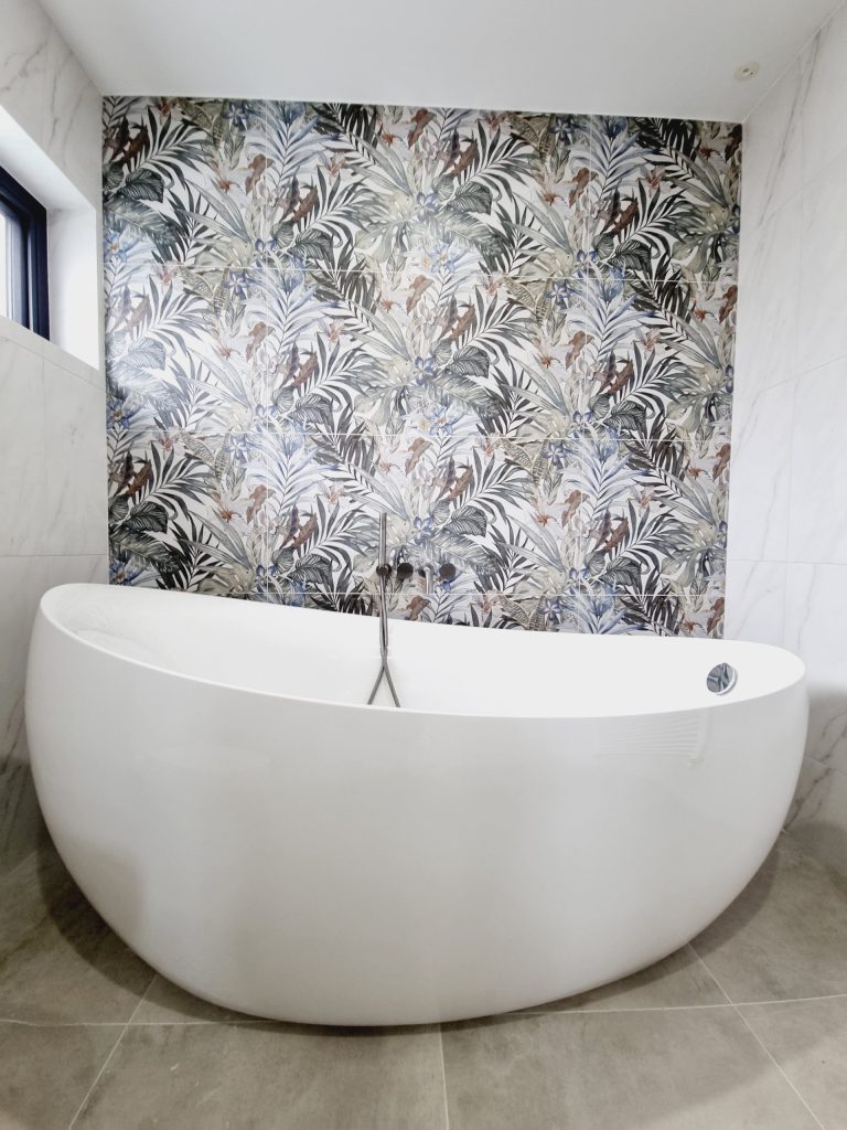 Freestanding bath with feature wall tile