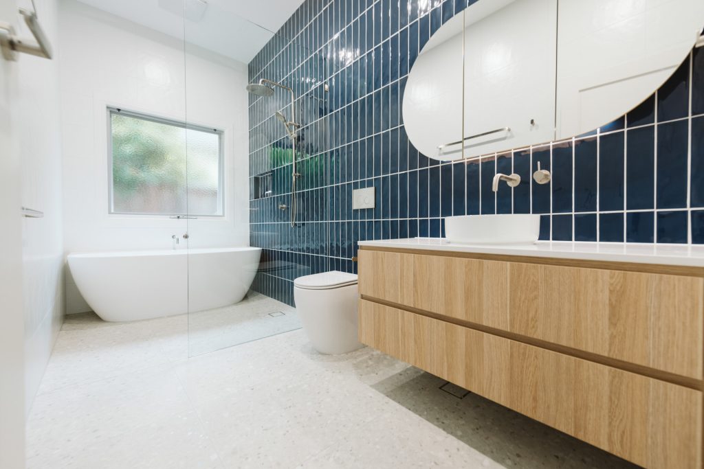 Bathroom with timber vanity, free standing bath